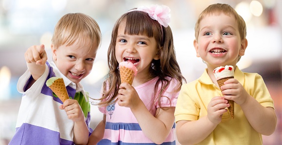 funny children group kidding with ice cream on party